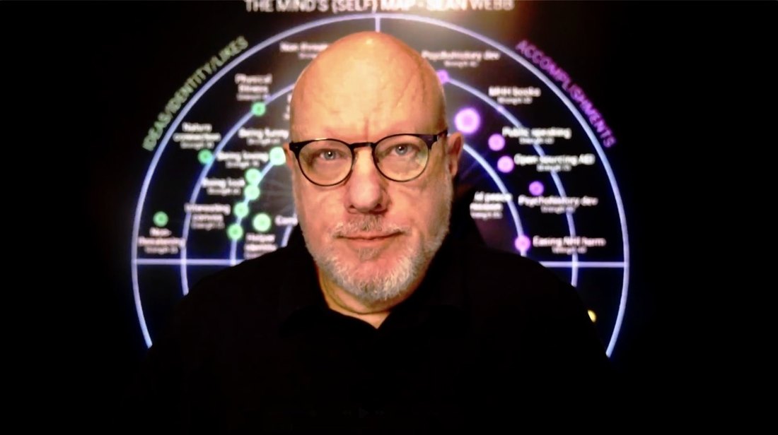 Sean Webb in front of the {self} map